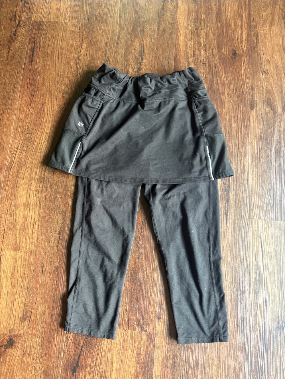 Athleta Black Leggings with attached skirt, side pockets, Reflective Accents